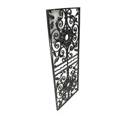 Wrought metal work panel, decorated with scrolls and foliage, central flower head motifs, black paint finish
