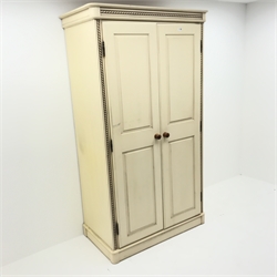 Painted pine double wardrobe, projecting cornice, two doors enclosing single shelf and hanging rail, plinth base, W111cm, H199cm, D60cm