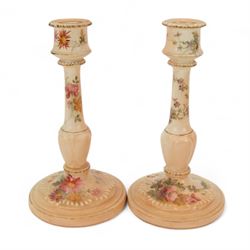 Royal Worcester blush ivory dressing table set, decorated with flowers, comprising an oval tray, three covered pots and a pair of candlesticks 
