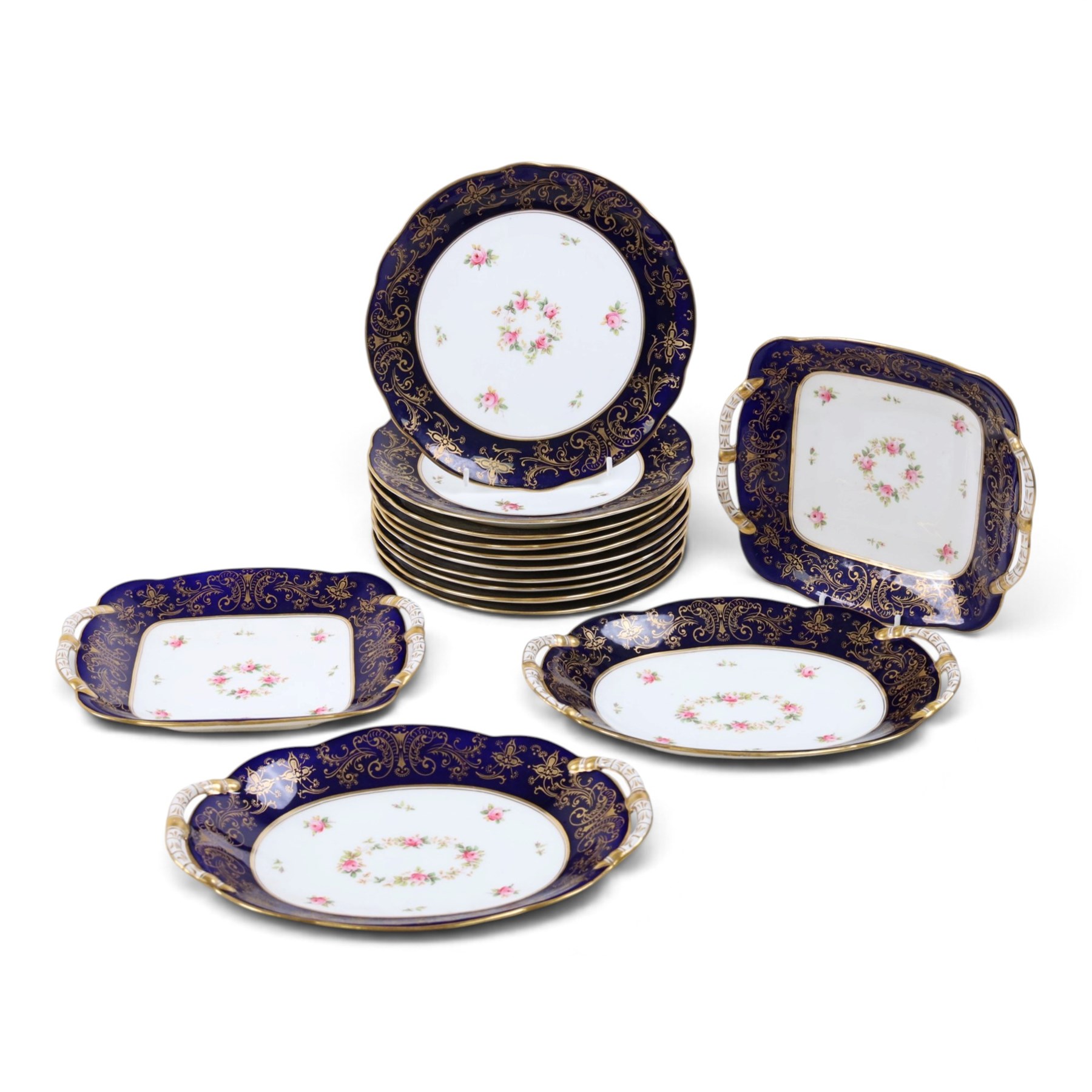 Coalport set of ten plates and four serving plates, each decorated with floral sprigs within a cobalt blue boarder with gilt detail, plates D22cm