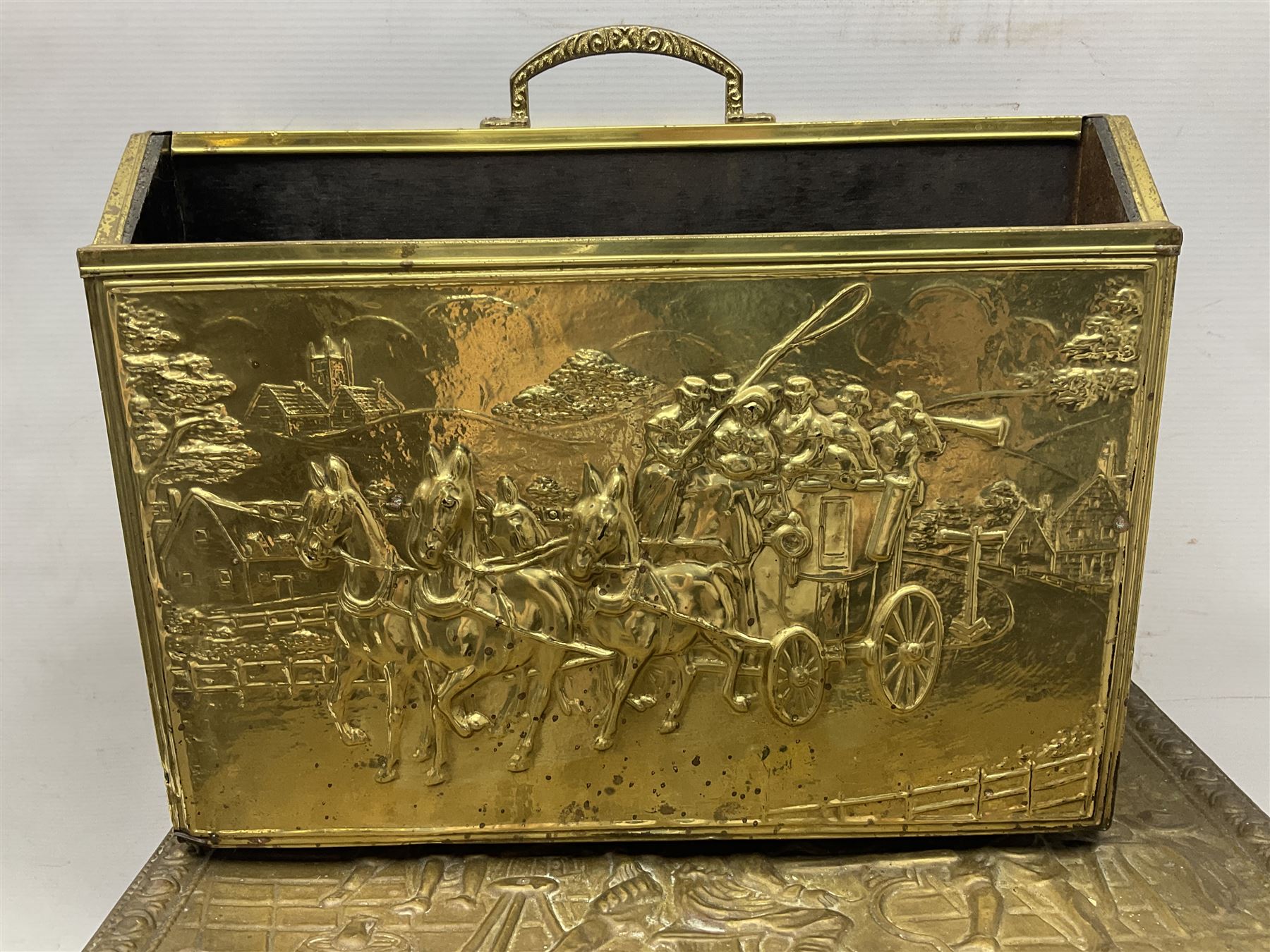Pair of brass and iron fire dogs, together with brass coal box embossed to the lid with figures and a brass magazine rack, coal box H32cm
