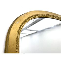 Tall Victorian hall mirror, in arched gilt frame with foliate mould slip, acanthus scroll corner brackets 