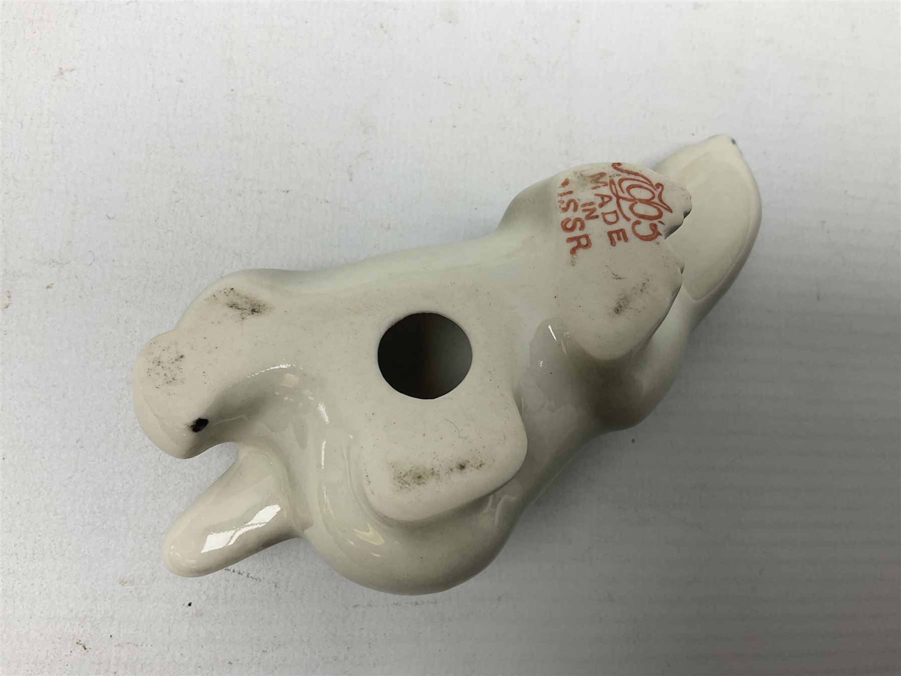 1970's Hornsea mugs, comprising Train Robber pattern designed by John Clappison and Owl from the ‘Newsprint’ Zoo range designed by Jack Dadd, and three USSR figures of animals comprising raccoon, ferret and badger