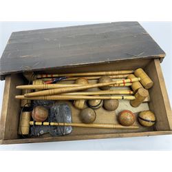 Table top croquet set with seven mallets and eight balls housed in pine box