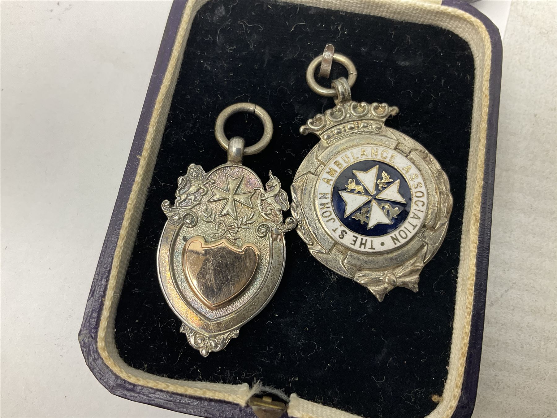 Four St John's silver fobs, together with two silver Directors Ambulance shield fobs and two other St Johns items 