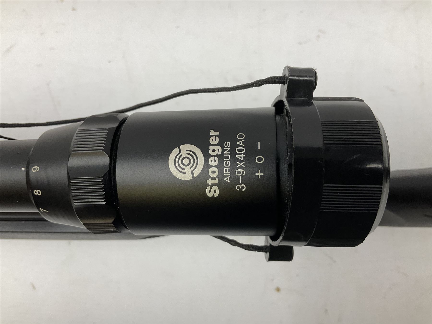 Stoegar .177 air rifle with break barrel action, 3 x 9 telescopic sight and fully integrated sound moderated barrel, no visible serial number, L109cm; in Stoeger lined gun sling