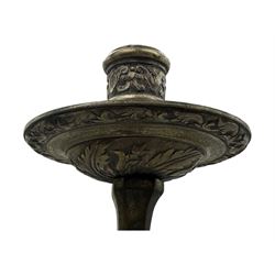 Early 20th century cast brass chandelier, the main baluster-form body surmounted by a lobed finial, with three cherubic heads and foliate scrollwork around the upper section, eight sweeping branches for lights