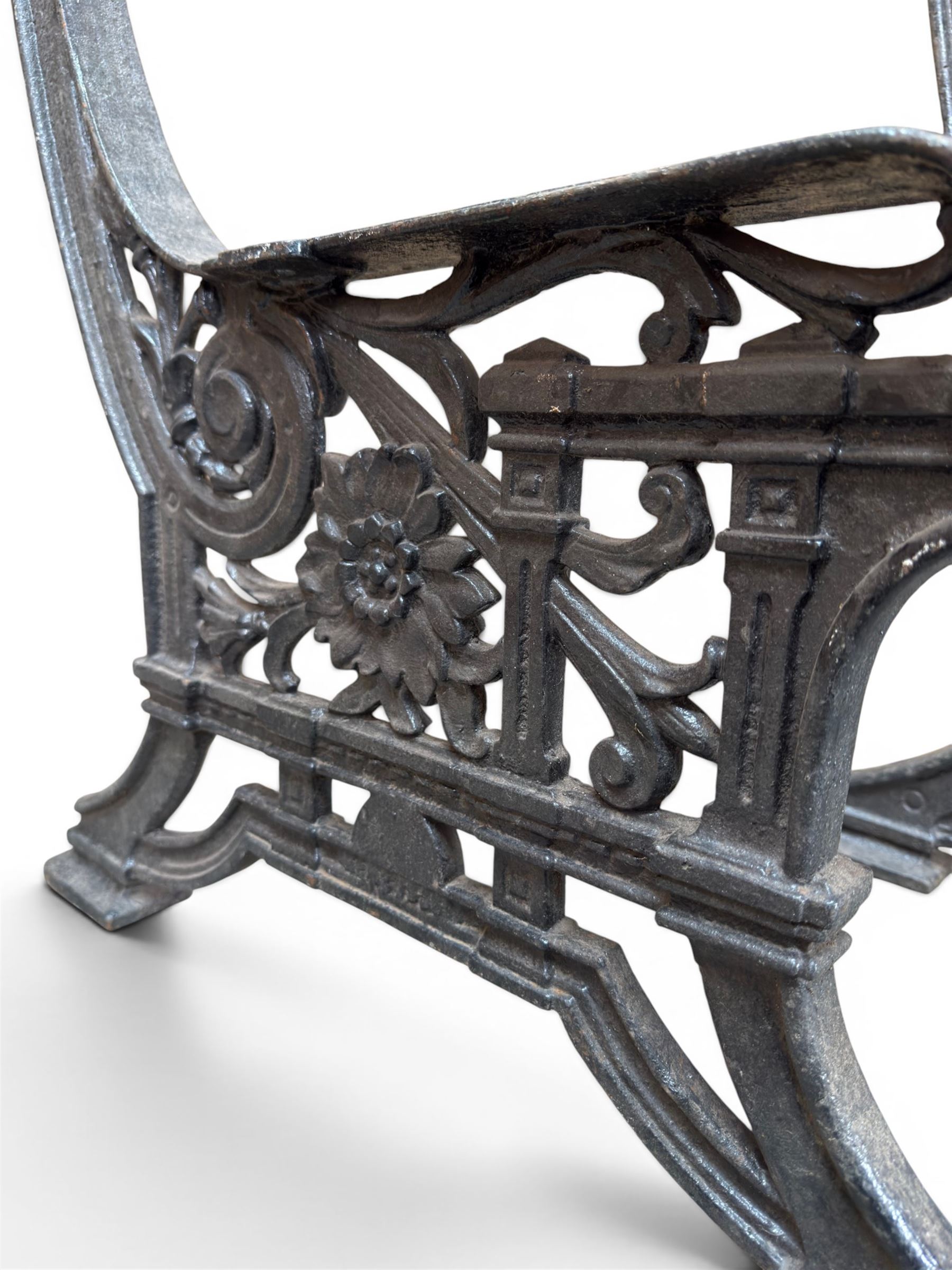 Yates Haywood - pair of Victorian cast iron bench ends, Architectural scrolling design with flower head detail, stamped with period registration number and date