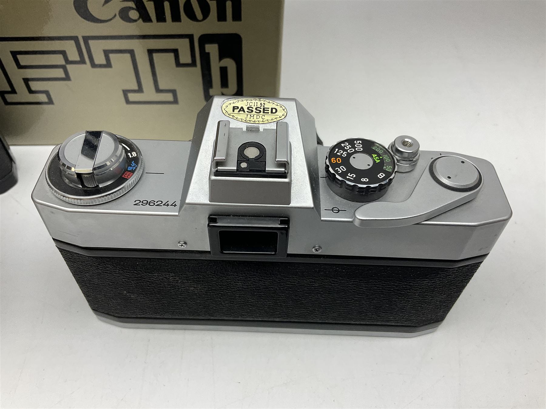 Canon FTb camera body, serial no. 715838, with 'Canon FD 50mm 1:1.8' lens, serial no. 207888, in original box, together with Canon FTb camera body, serial no. 557817, with 'Canon FD 35mm 1:3.5 S.C' lens, serial no. 126210 and Canon EX Auto camera body, serial no. 296244 with 'Canon EX 50mm 1:1.8' lens, serial no. 380869  