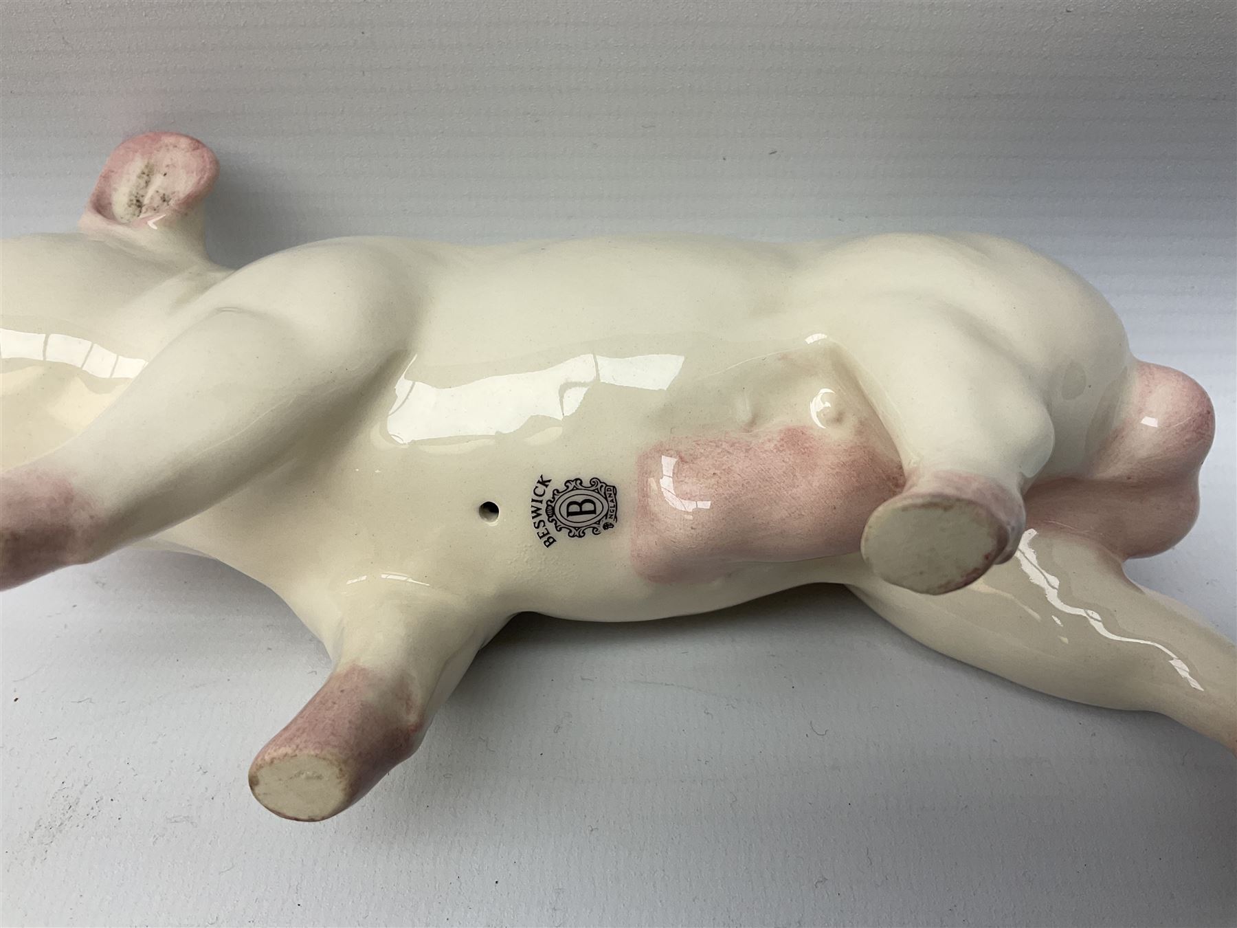 Collection of Beswick pig figures, to include John Beswick Little Likeables ‘Hide and Sleep’, white boar pig and John Beswick trio of pigs, all marked beneath (5)