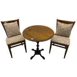 Pub table with circular top on cast ornate iron base; and two chairs