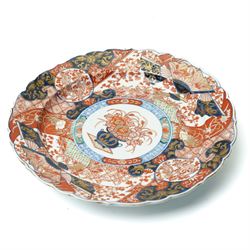 Japanese Meiji period imari charger, painted centrally with vase and floral bouquet, surrounded by fans and traditional motifs, D34cm 