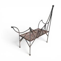 Victorian design wrought iron garden bench, with asymmetrical rope-twist frame, arched back and sides over out-swept arm terminals with ball finials, flanking a lattice seat, in antique black-painted weathered finish