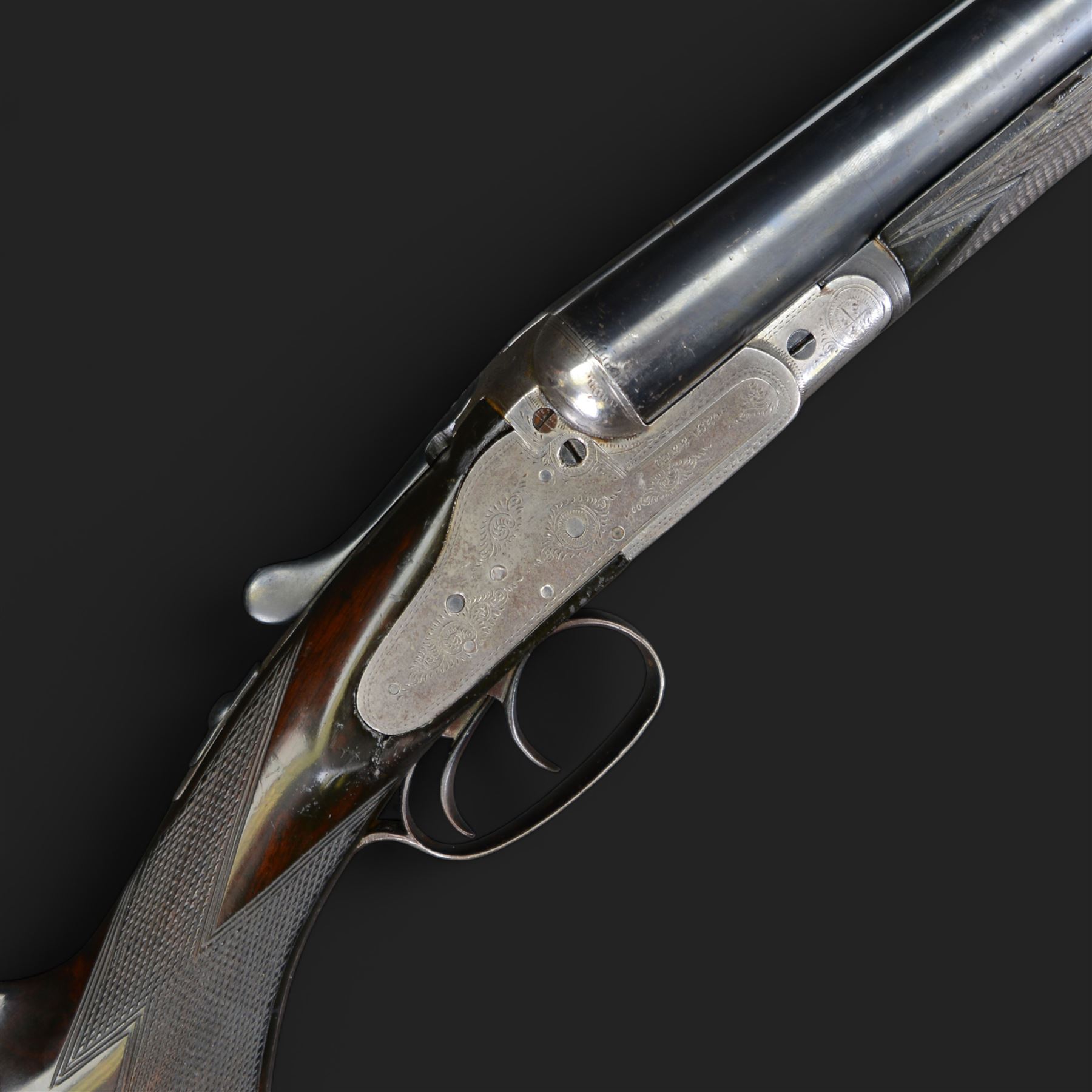 Carr Brothers of Huddersfield 12 bore side by side shotgun with engraved sidelock plates, trigger guard, underside, top plate, thumb lever and fences, chequered semi-pistol grip and horn tipped forend, vacant cartouche to the underside of the stock, double trigger and named 28 inch sleeved barrels choked ¾ and ½, overall length 113cm SHOTGUN CERTIFICATE REQUIRED