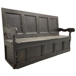 18th century oak box seat settle bench, pegged construction with quadruple panelled back over double hinged box seat, shaped projecting arms with scroll carved terminal detail, on block and bobbin turned front supports, panelled front within moulded frame