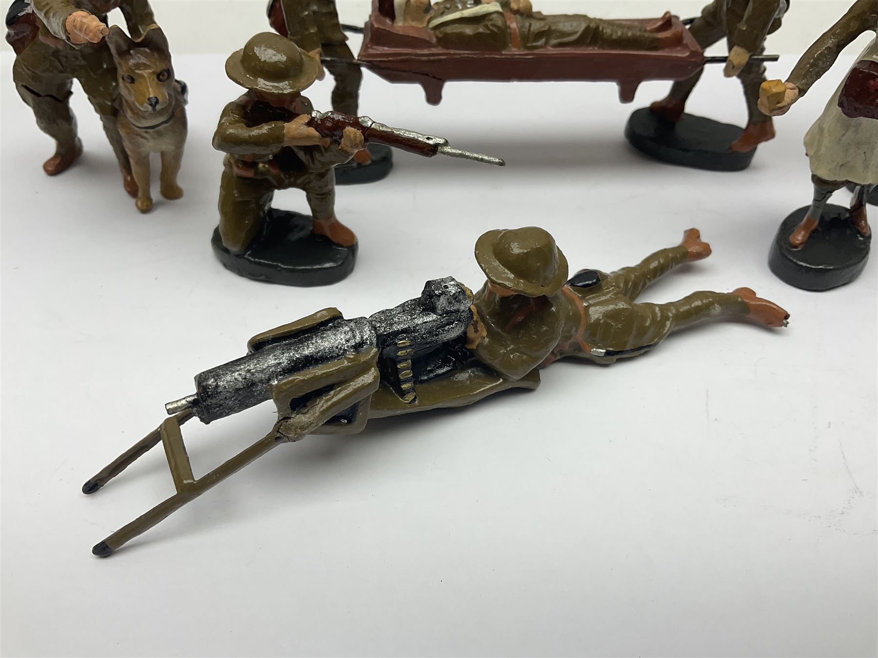 Eight Elastolin British soldiers and wartime figures, including nurse, injured soldier on stretcher, soldier with dog, etc, tallest 11cm