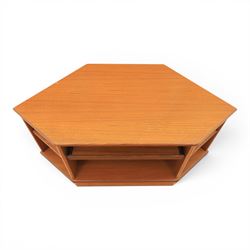 G-Plan - teak corner media unit, shaped top above a sliding central shelf above an open recess, flanked by further shelves, raised on a plinth base with a rear aperture for wires