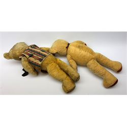 1950s English large wood wool filled teddy bear with swivel jointed head, glass type eyes and vertically stitched nose and mouth and jointed limbs with rexine paw pads H33