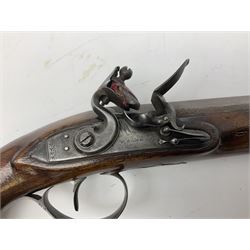 Early 19th century flintlock 16-bore overcoat/duelling pistol by William Bond Lombard Street London, the 23cm octagonal brown stub twist damascus barrel with small foresight, two barrel pins and ram rod under, inscribed Lombard Street London to the top and W. Bond to the action, full walnut stock with lightly engraved steel furniture, pineapple finial and escutcheon, half cock facility L39cm; loose mounted on later mahogany display stand with trade label