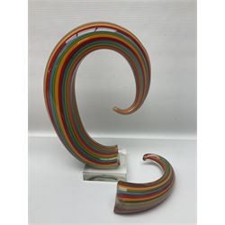 Three art glass sculpture, coiled form with multicolour stranded, upon clear glass plinth, unsigned, largest H27cm