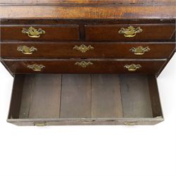 18th century inlaid oak bureau, the fall-front with central star inlay enclosing fitted interior with central cupboard flanked by fluted column correspondence drawers and pigeon holes, over two short and three long drawers, lower moulded edge on bracket feet