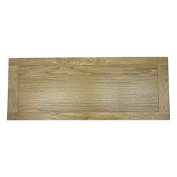 Contemporary oak television stand, rectangular top over two central open compartments, flanked by panelled cupboard doors enclosing additional shelves, raised on stile supports