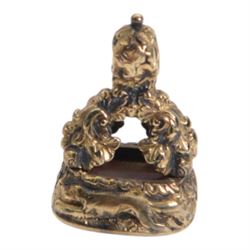 Late 18th/early 19th century 12ct gold fob seal, the carnelian matrix engraved with the Chichester family coat of arms, depicting a chequy shield beneath a crest of a heron with an eel in its beak, within a scrolling foliate mount, the sides detailed with a hound in chase and birds, H3cm

Provenance: By family descent from the Chichesters of Arlington Court, Devon; from the collection of Andrew Chichester Everitt.

