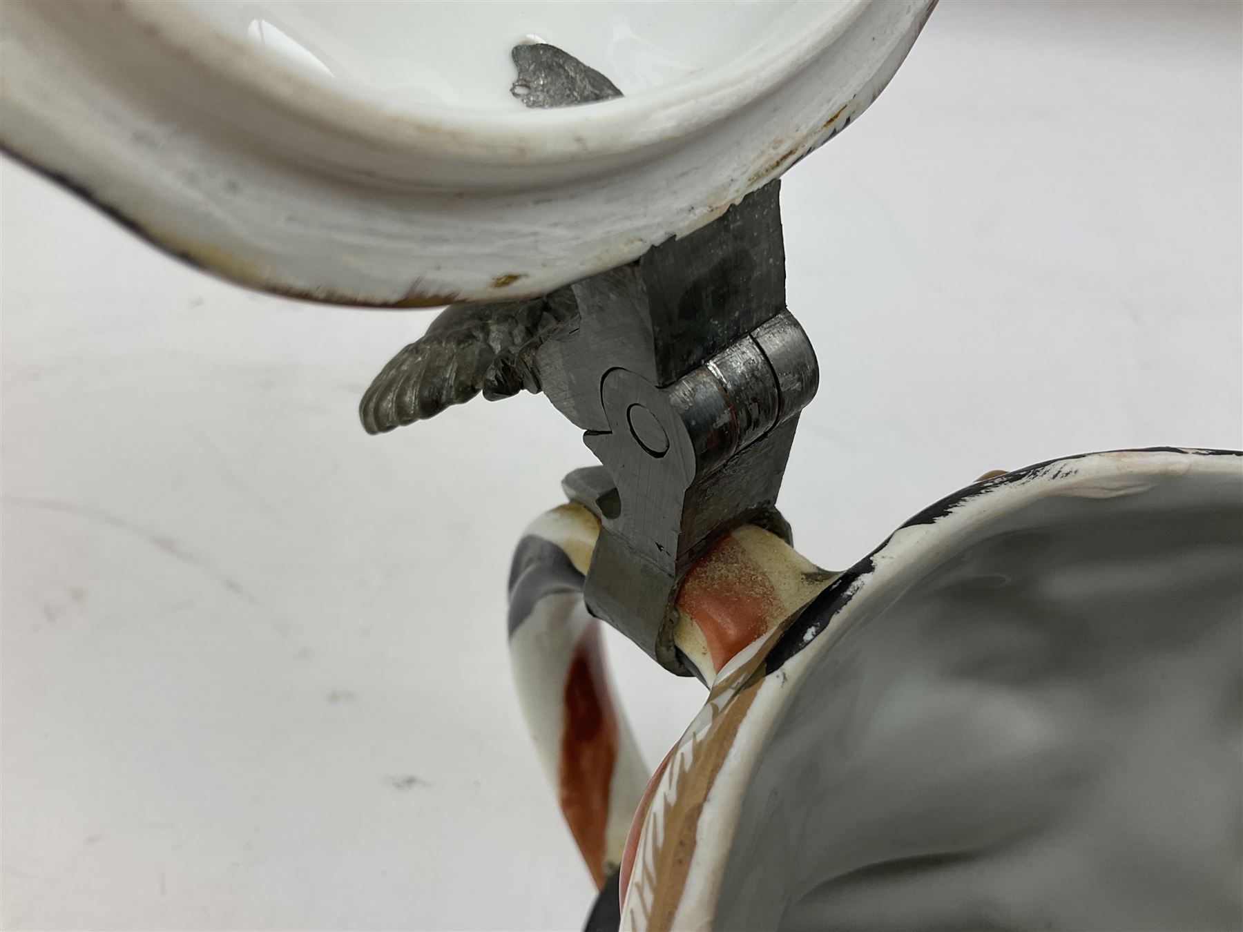 Otto Von Bismarck figural 0.5l stein, his black pickelhaube helmet with chrome spike serving as the lid, in green uniform and gilt detail throughout, pewter thumb hinge, with blue hash Musterschutz type mark, H18cm