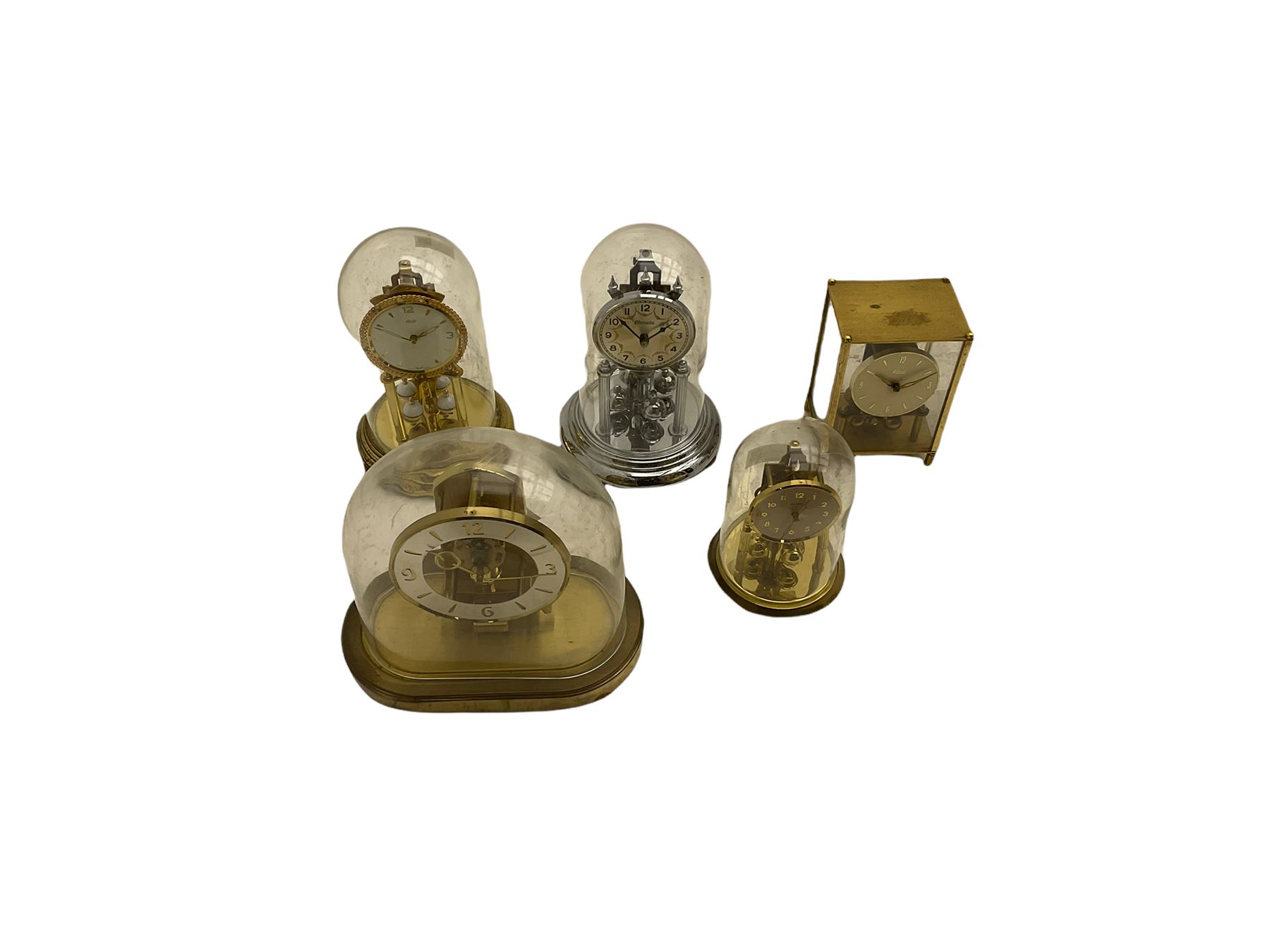 A  late 20th century German Kieninger & Obergfell, “Kundo” battery operated 
mantle clock under an acrylic shade, with four German anniversary torsion clocks
