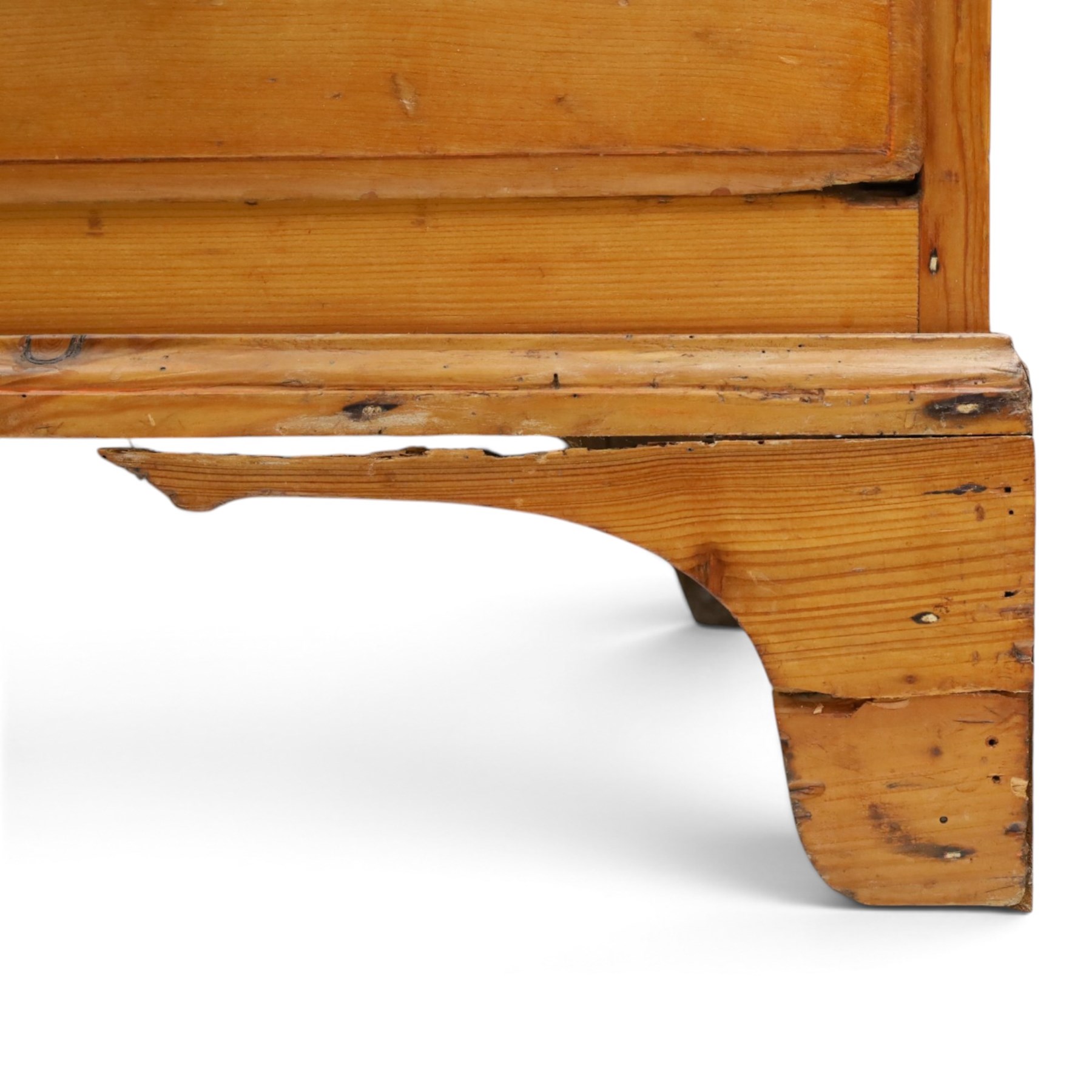 19th century waxed pine press cupboard, shaped cornice above a twin fielded panelled cupboard door enclosing a fixed shelf, the lower section two short two long drawer