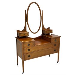 Edwardian inlaid mahogany dressing table, oval swing mirror, trinket drawers, above two small and two long drawers