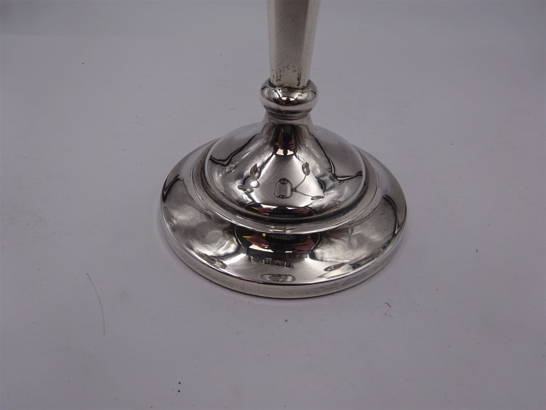 Modern silver mounted three branch candelabra, the tapering stem supporting a central candle holder and two removable curved branches with candle holders, upon spreading circular foot, hallmarked Birmingham 1968, maker's mark worn and indistinct, H25.5cm