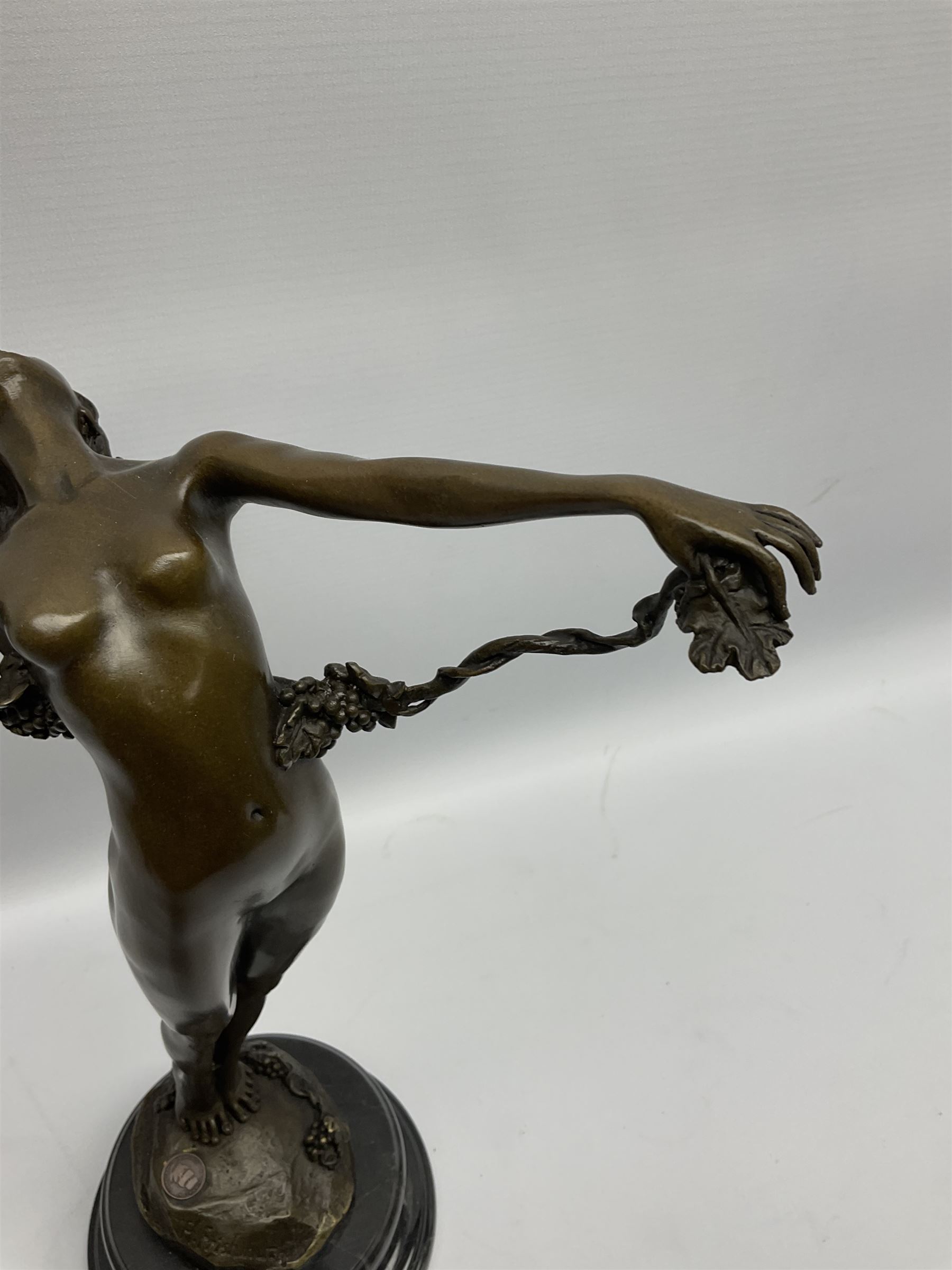 Bronze figure of a nude female holding a vine, after 'H. Frishmuth', with foundry mark on socle base, H38cm
