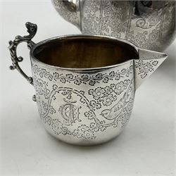 Late Victorian silver bachelors three piece tea service, comprising bullet shaped teapot, open sucrier and milk jug, each engraved with monogram surrounded by birds upon and amidst a blossoming vine, the teapot with scroll capped curved wooden handle and wooden finial to cover, hallmarked Wakely & Wheeler, London 1890, teapot including handle H12cm, sucrier H5.5cm 