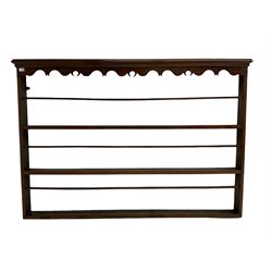 20th century oak wall hanging plate rack, shaped fretwork frieze over three tiers