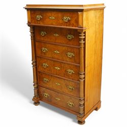 Tall late 19th century walnut chest, stepped and moulded top over six drawers, ornate cast gilt metal handles, enclosed by turned and fluted upright columns, on turned front feet 