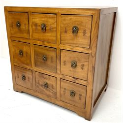 Eastern hardwood haberdashery style chest, nine drawers, style supports
