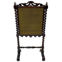 Victorian rosewood fire screen, scrolled foliage carved pediment, rectangular frame with moulded gilt slip enclosing figural needlework tapestry panel, on spiral turned supports with finials united by turned lower stretcher, on out-splayed feet with scroll carved terminals 