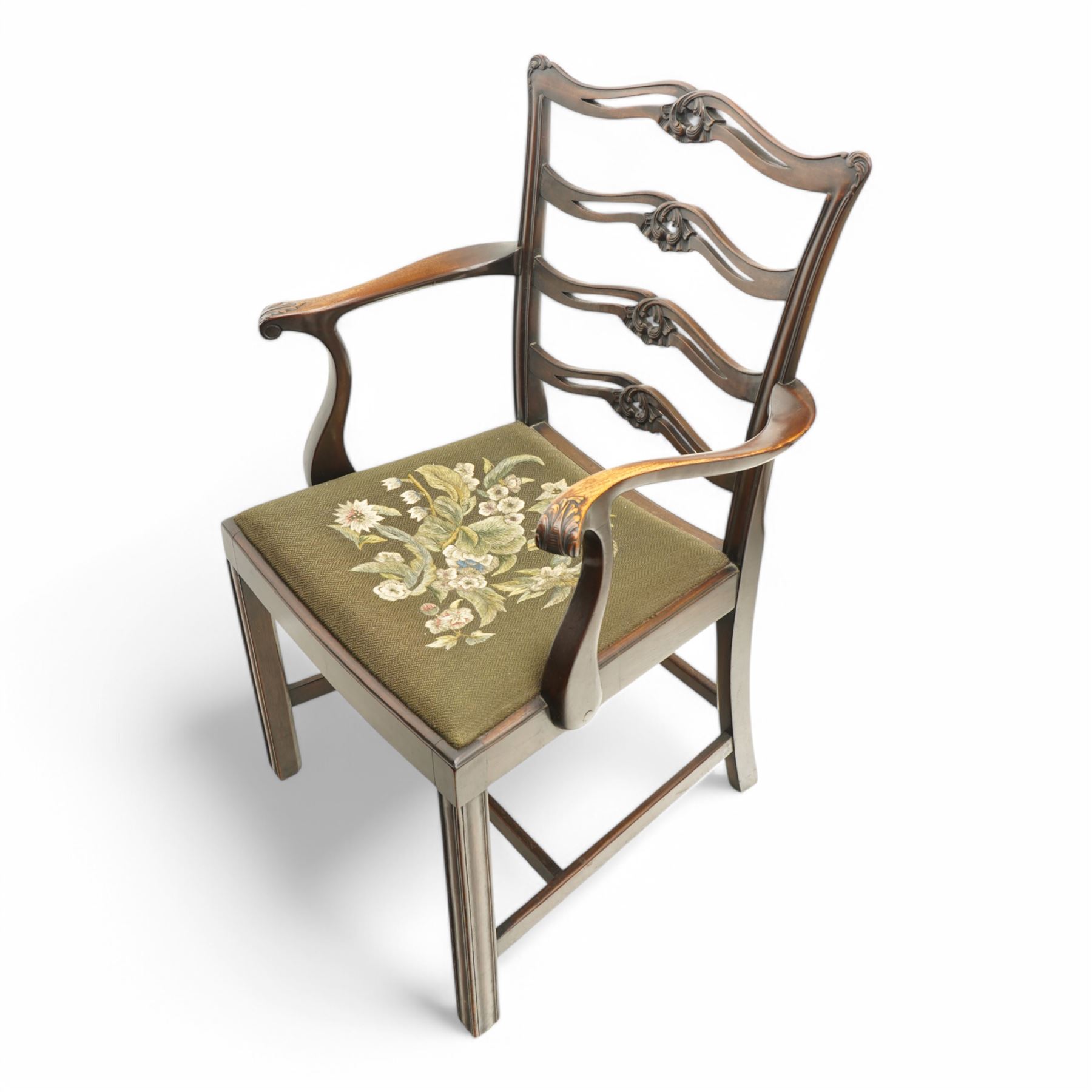 Set of eight (6+2) early 20th century Chippendale design mahogany dining chairs, waved and pierced ladder back carved with shells and curled leaves, moulded upright rails, dished seats with upholstered drop-in seat cushions, on square moulded supports united by plain stretchers 