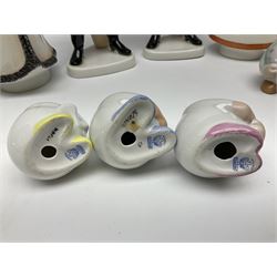 Group of eleven Aquincum of Budapest figures, comprising two of a man in a feather hat, seven dwarves, man and woman in traditional dress, all with printed marks beneath