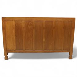 Mouseman - oak sideboard with adzed top and raised gallery back, over two short drawers and three long drawers, flanked by panelled cupboard doors with wrought iron fittings, on octagonal feet, carved with the signature mouse to the right-hand door