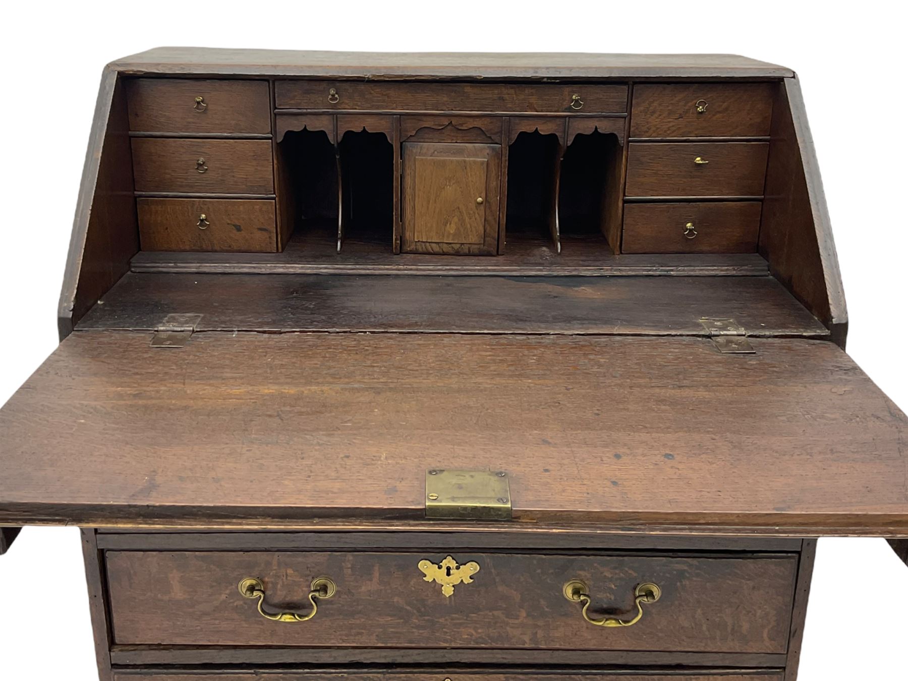 Georgian oak bureau, fall front enclosing fitted interior, four long graduating drawers, on bracket feet