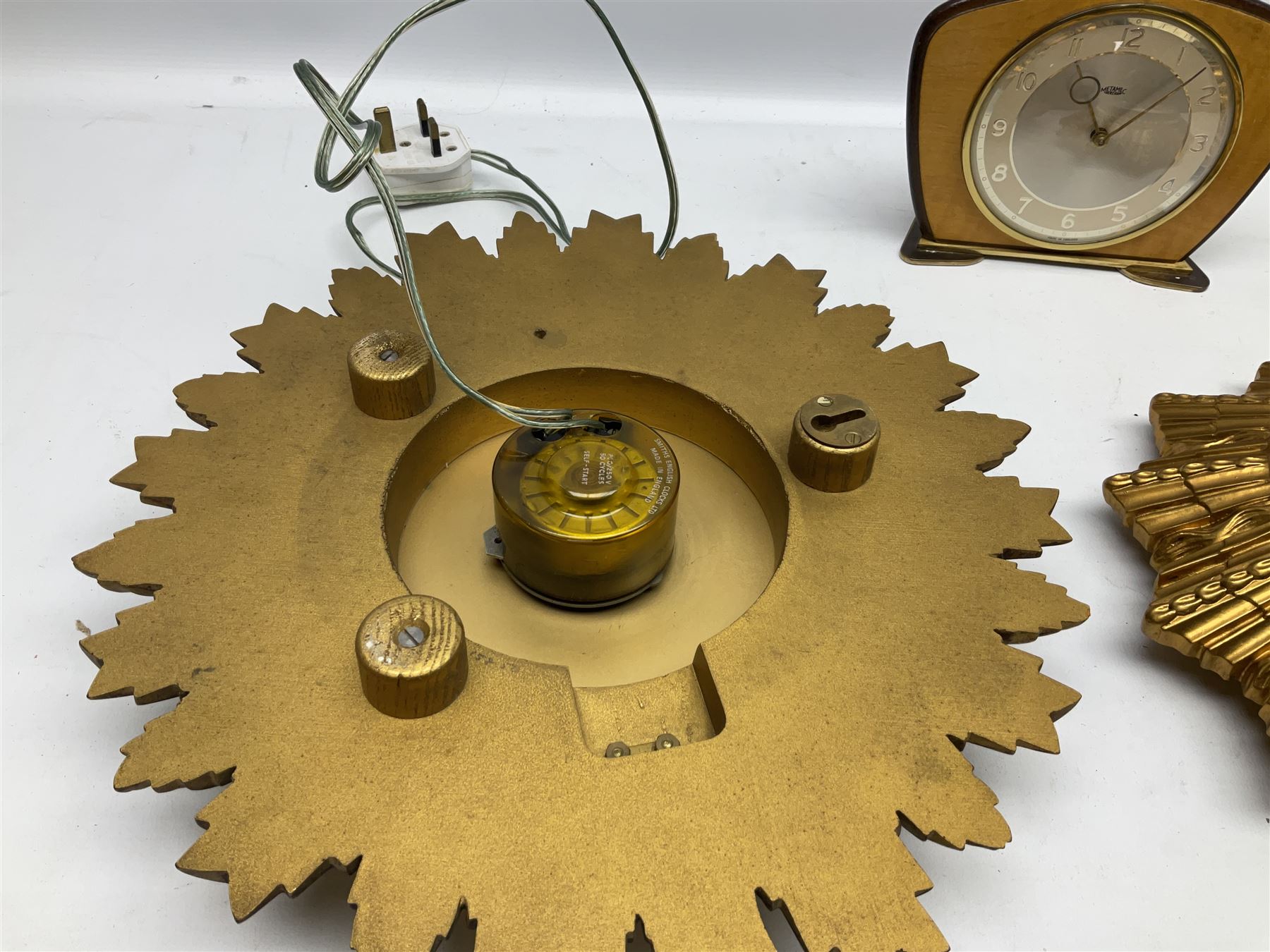 Two Smiths Sectric gilt sunburst wall clocks together Metamec Dereham wooden mantel clock, largest wall clock D35cm