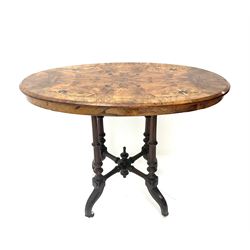 Victorian walnut occasional oval table, inlaid top, turned tapering supports, central finials, shaped legs and castors