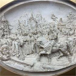 Justin Mathieu, two oval high relief plaque depicting a battle scenes, each within a wooden frame, frame  H21cm, L25cm
