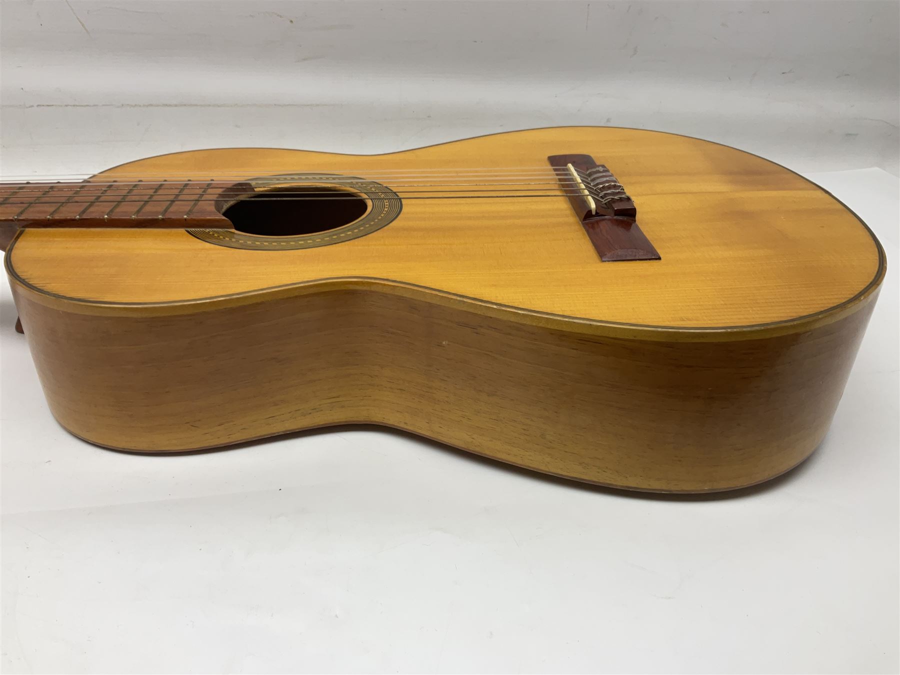 Encore black electric cut-away guitar L96cm; and Spanish Victor Garcia model 187 acoustic guitar, bears label dated 1972 L99cm; each in soft carrying case (2)