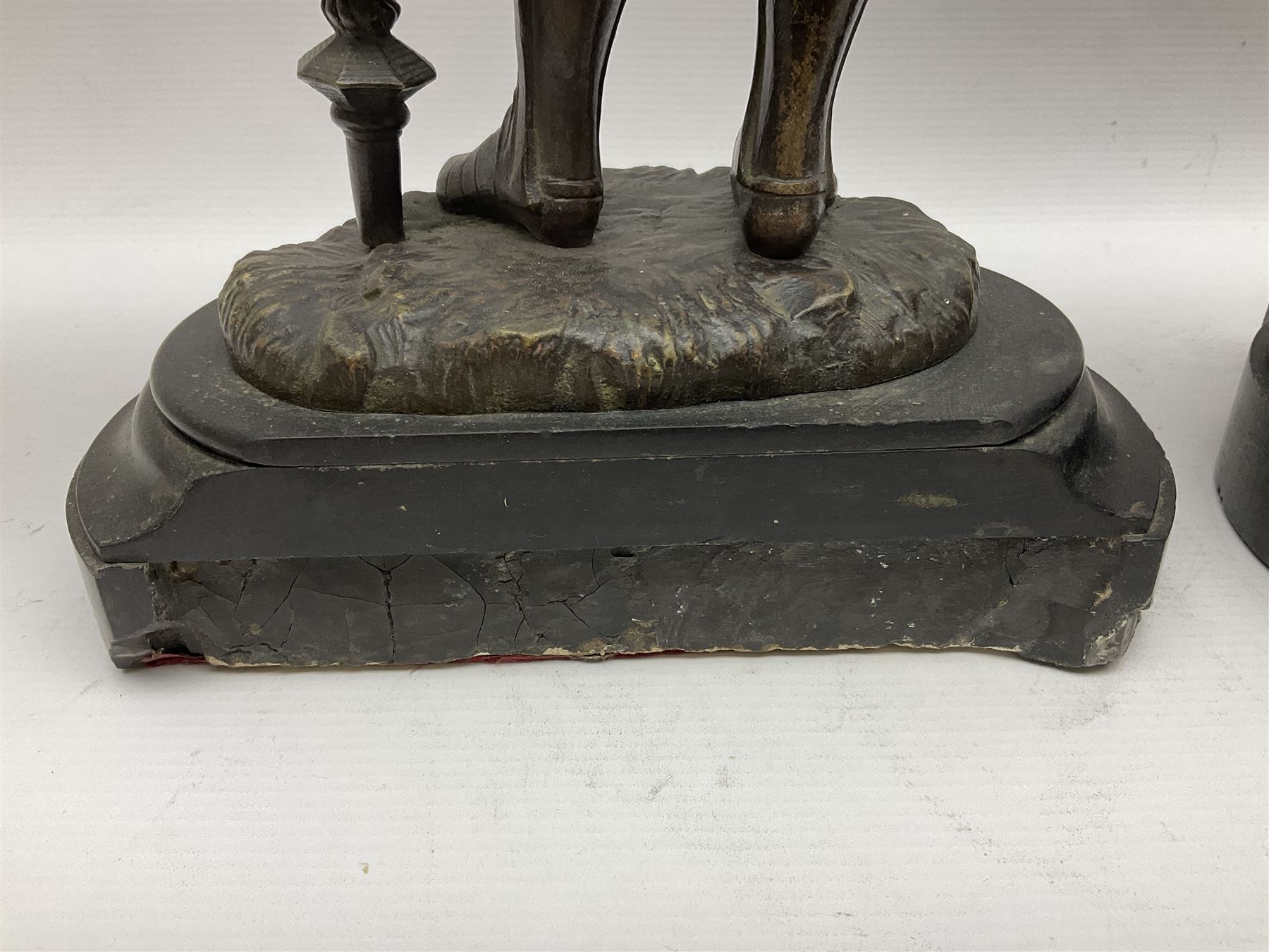 Pair of bronzed figure modelled as a hunter in traditional dress, each holding a pike, H48cm