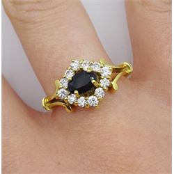 18ct gold sapphire and cubic zirconia marquise shaped ring with scroll shoulders