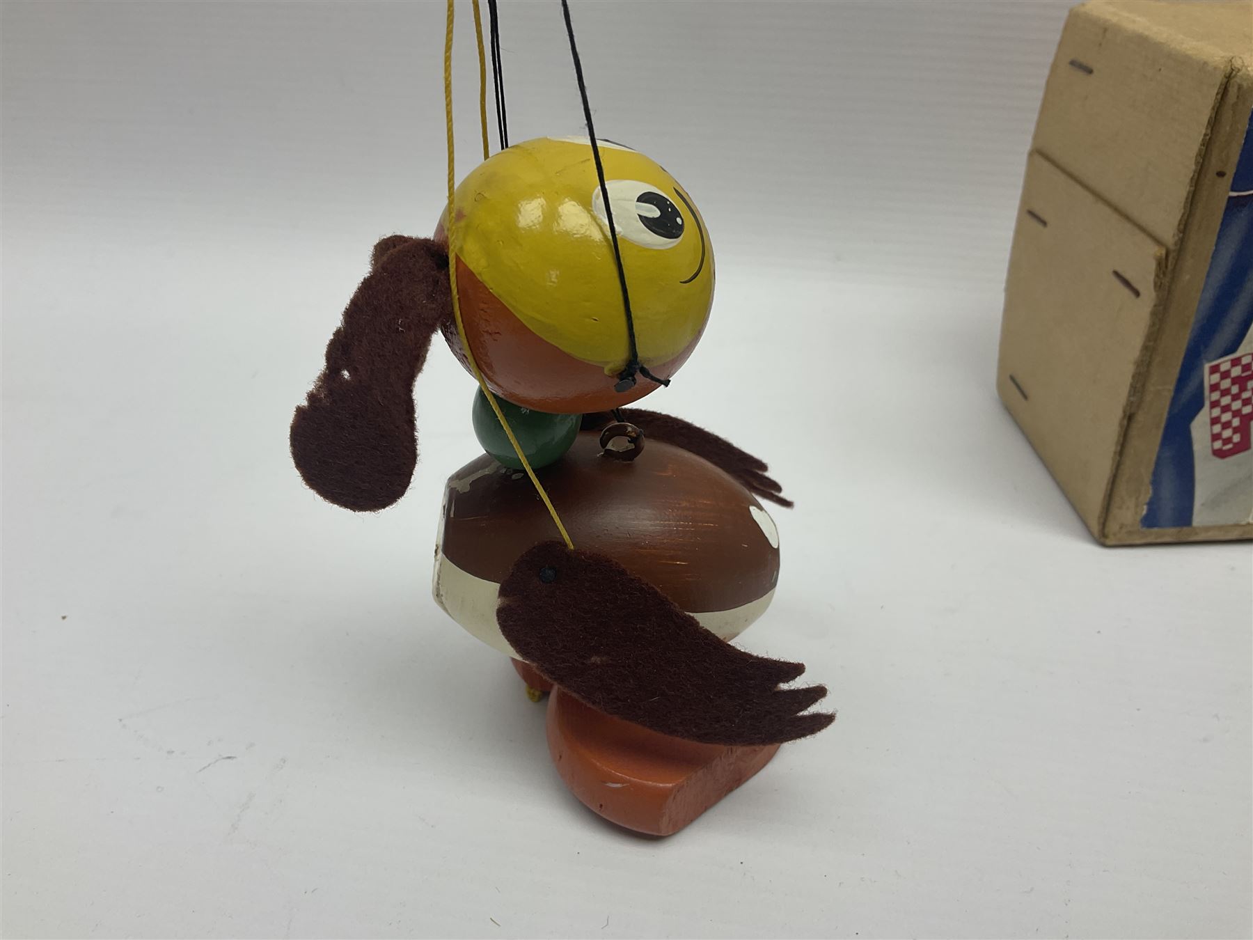 Pelham Puppet - three puppets comprising a painted wooden duck with felt mouth and wings with metal joints H12cm, in original box and instructions; and two further examples Type A cat with a hollow body H12cm, and a boy H23cm (3) 