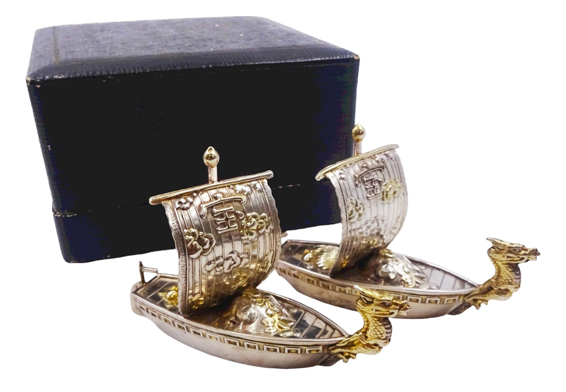 Pair of 20th century Japanese silver novelty cruets, modelled in the form of Viking long ships, marked Sterling Japan, contained within a fitted case, approximate silver weight 1.18 ozt (36.6 grams)